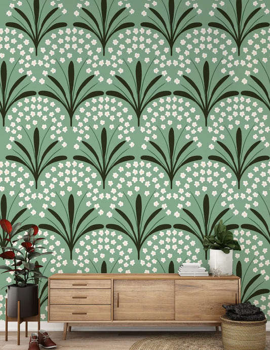 Hallway wall covered in botanical wallpaper with daisy fan motif and palm leaves.
