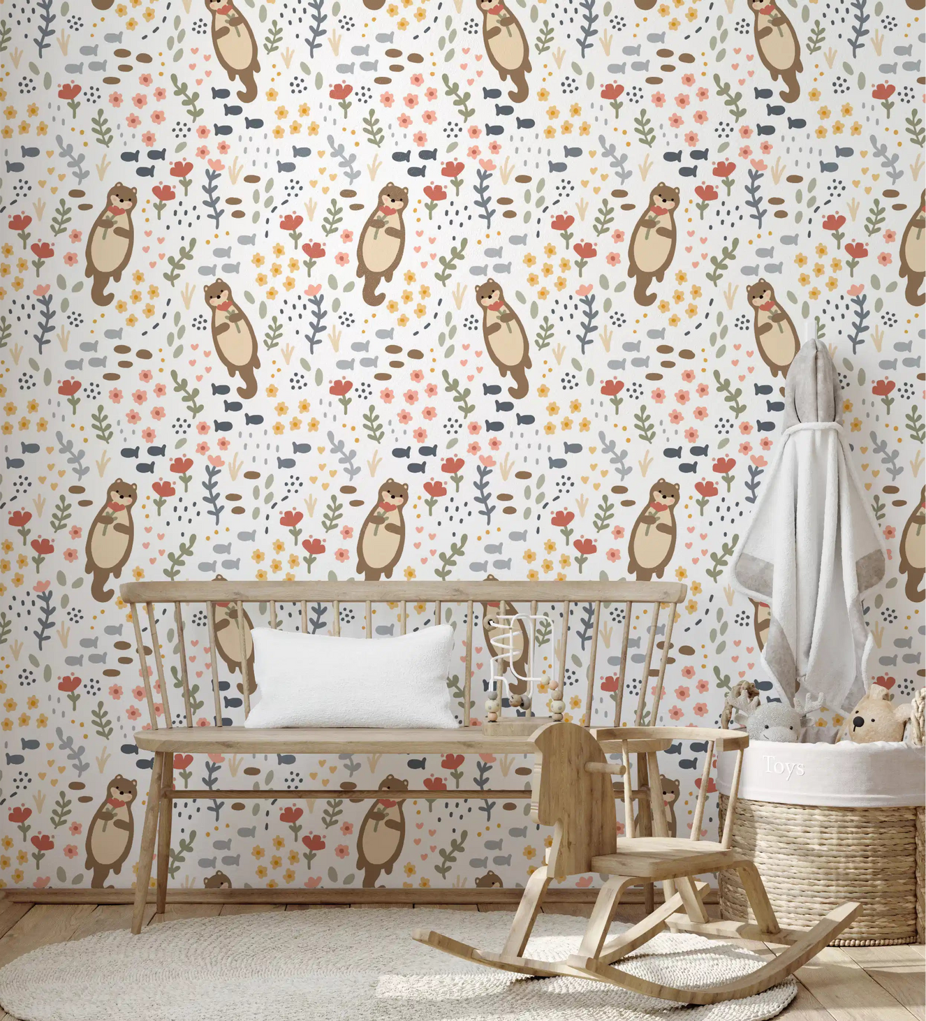 Nursery wall in otter wallpaper with wildflowers, fish, and soft pastel tones.