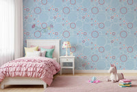 Crisp white circles and daisies wallpaper with red rings and jellyfish drawings.