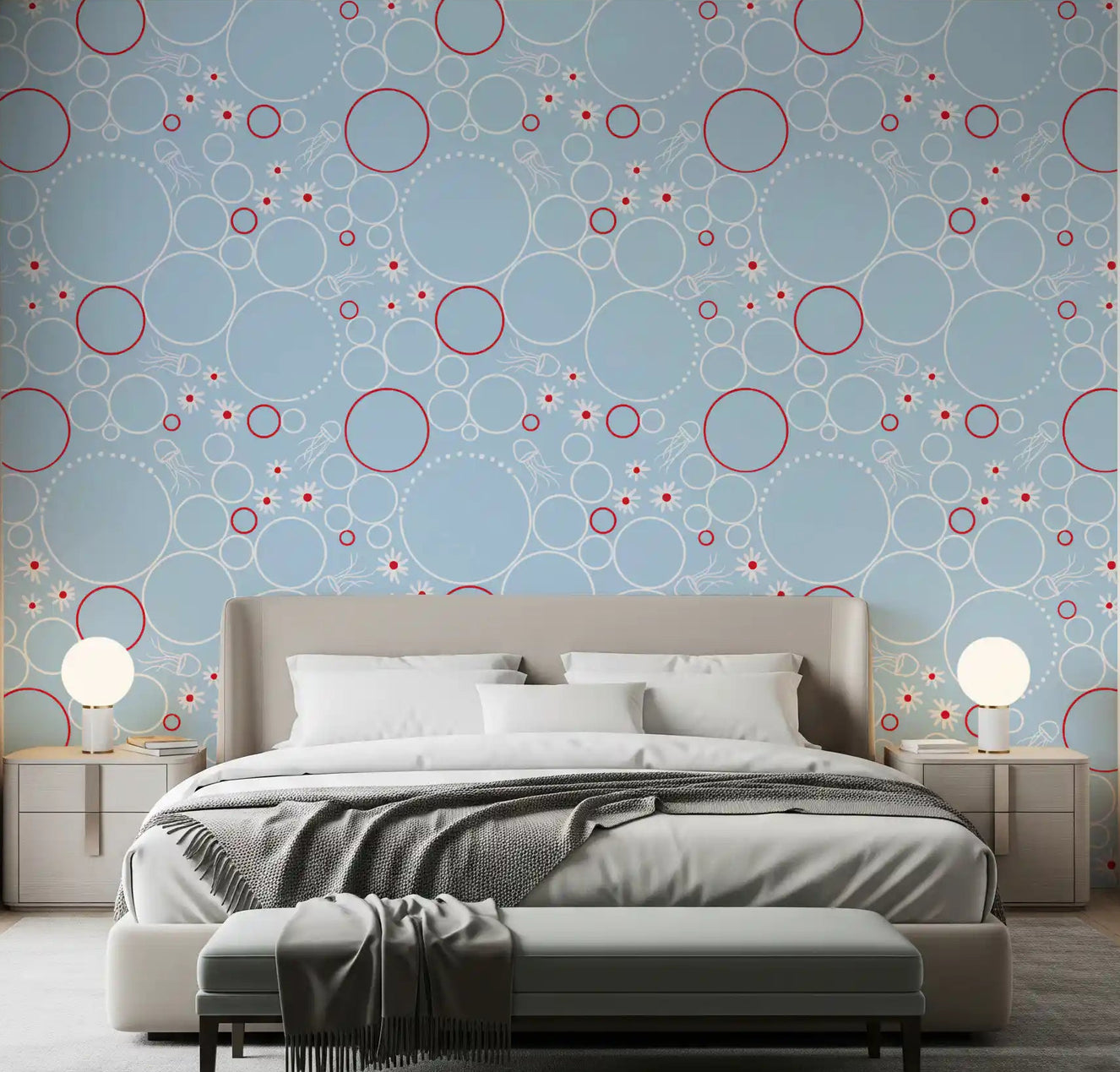 Pale blue wallpaper with white circles, red rings, daisies, and jellyfish in bedroom.