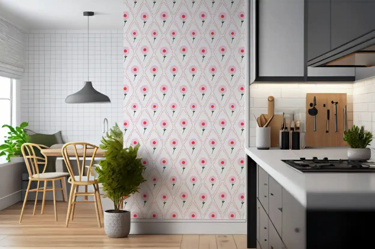 Pink rose wallpaper with red centres set inside scalloped diamond frames in kitchen.