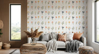 Small berry stems, daisy fans, and bell flowers across a clean white wallpaper.