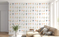 Living room wall covered in scattered wildflower blooms across a white wallpaper.