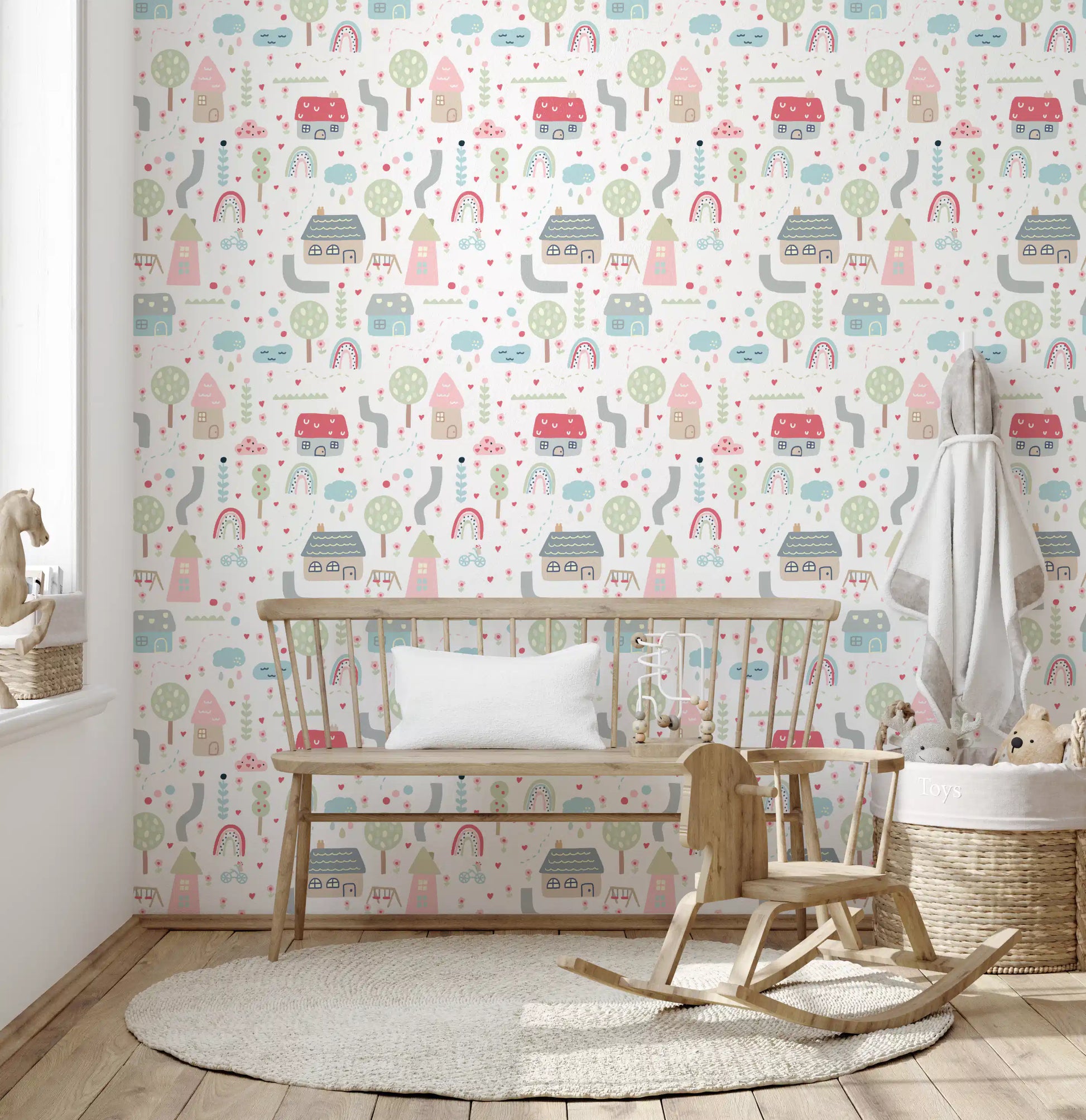 Soft pastel storybook wallpaper with little houses trees and rainbow arcs.