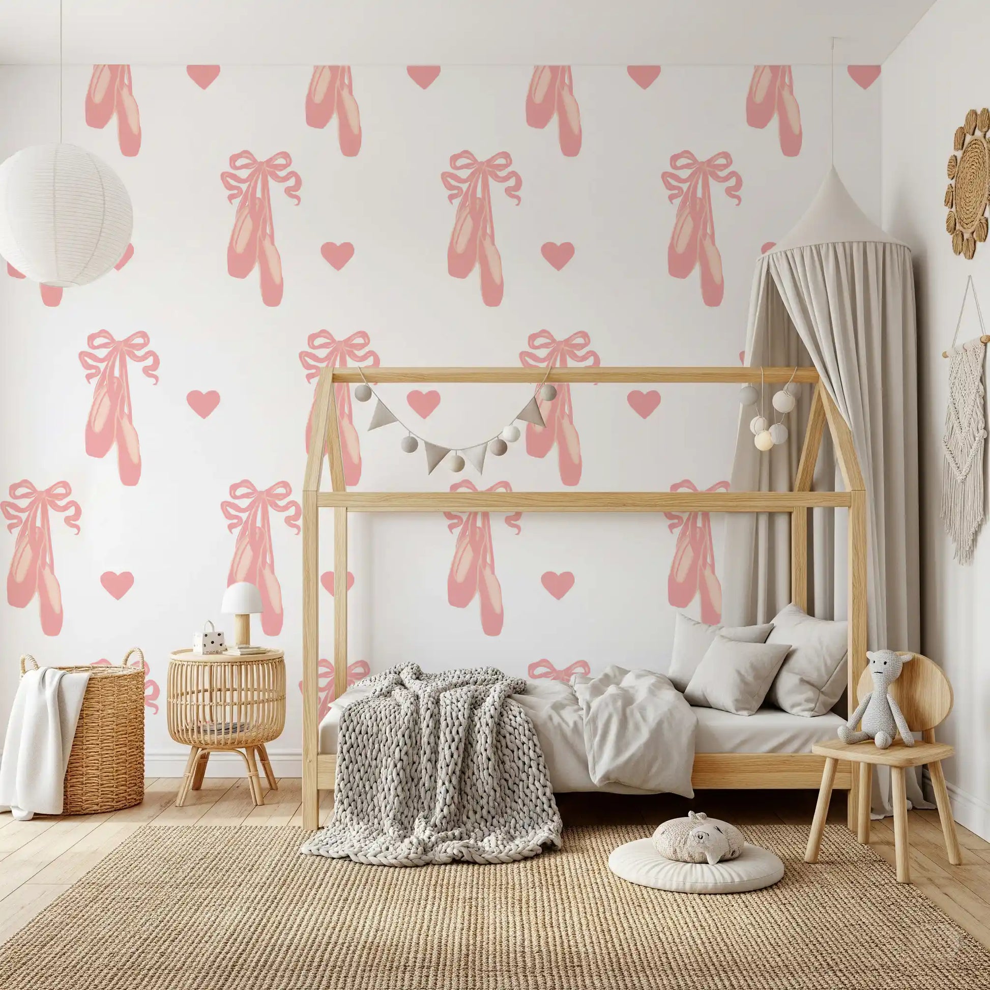 Repeating motif of pink shoes, hearts and bows on a white wallpaper.