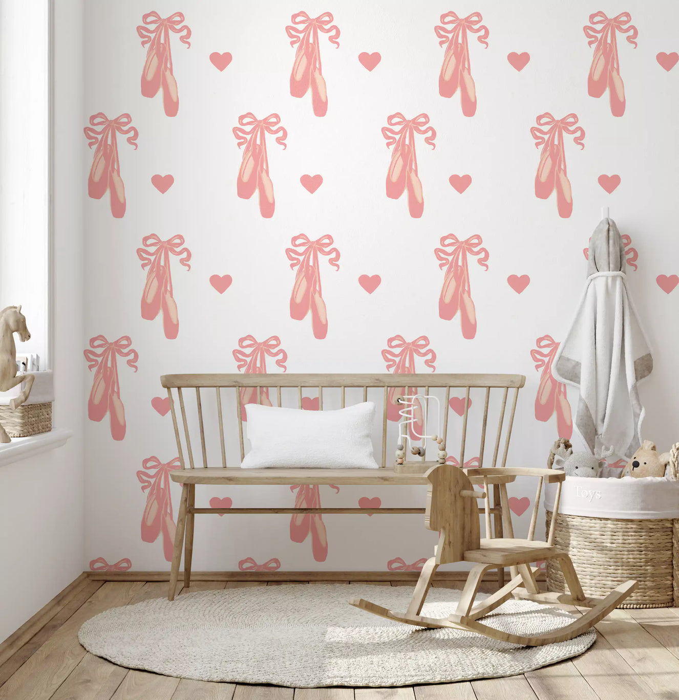 Soft hearts and tied ribbon bows arranged on a pink ballet wallpaper.