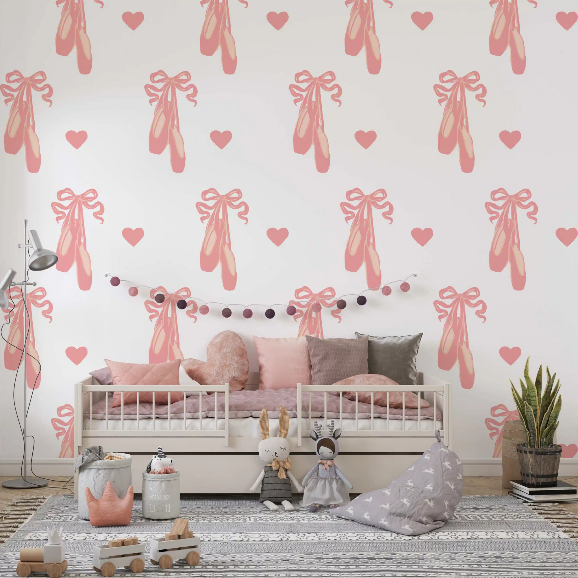 Pink ballet pointe shoes with trailing ribbons across a white wallpaper in nursery., GD10119