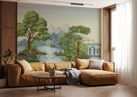 Living space opened up with a jungle wall mural where elephants walk along a green riverbank.