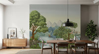 Misty grey mountains rise behind green canopies in the jungle wall mural's far distance.