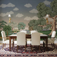 Muted woodland mural with deer, slender trees, and a grey-blue sky in dining room.
