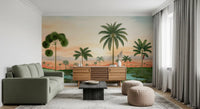 Flowering green shrubs lining the foreground of a tropical palm mural.