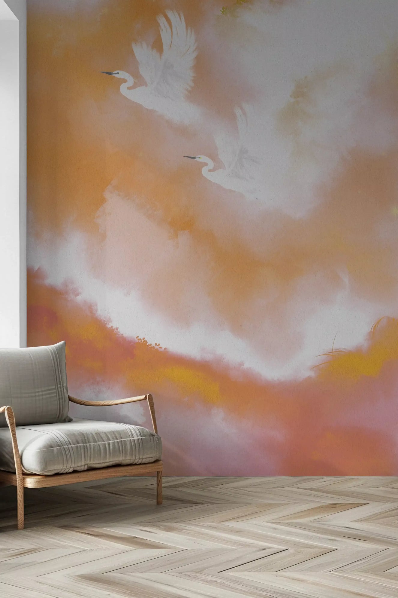 Two white birds flying in peach and orange watercolor clouds wall mural in hallway.