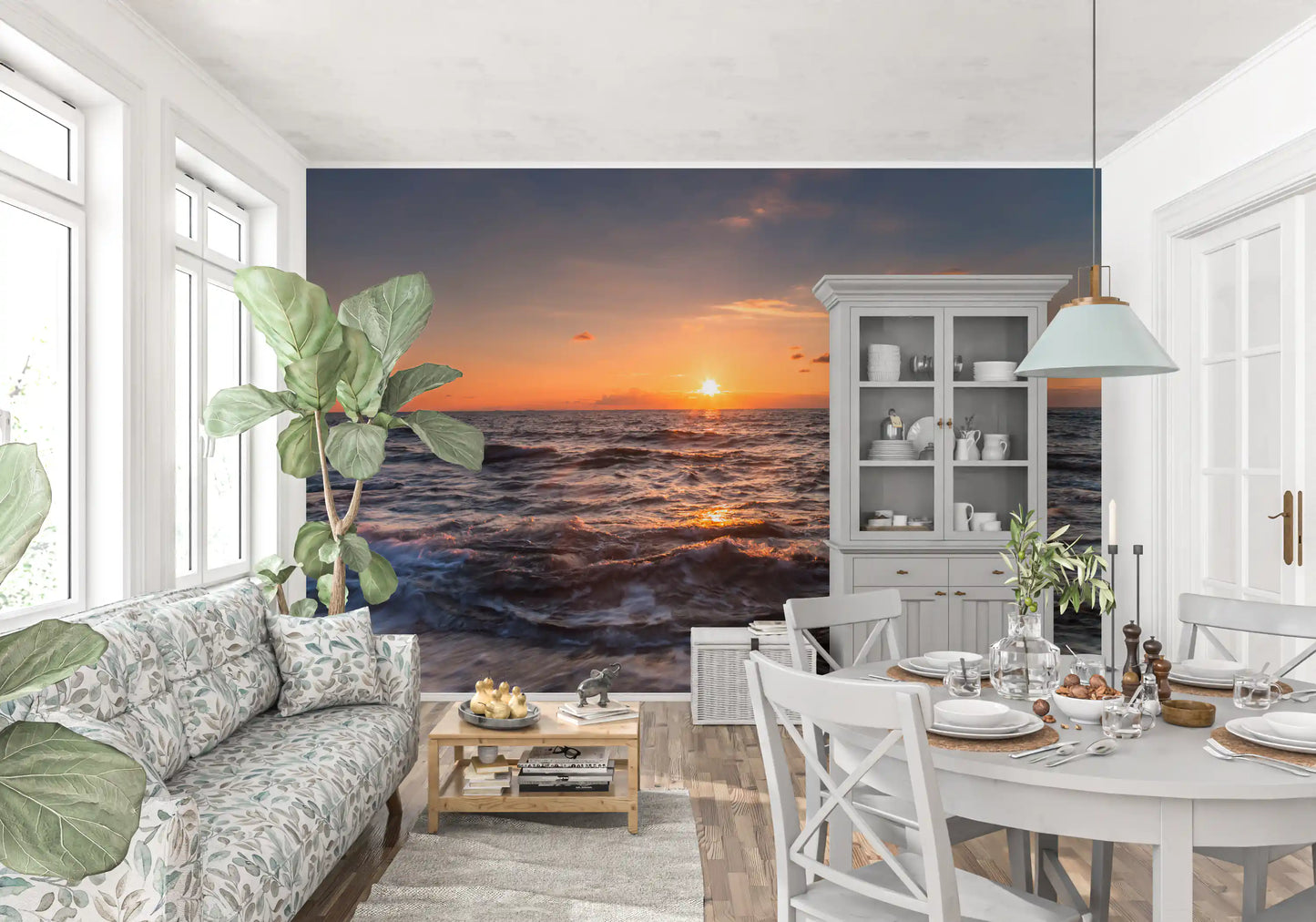 Ocean horizon mural on a lounge wall showing golden sky over moving water.