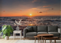Golden Horizon Waves wall mural on a living room feature wall with a warm sky.