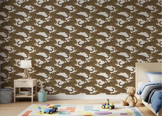 Leaping leopard pattern wallpaper across a kids bedroom feature wall in gold and charcoal.