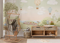 Pastel hot air balloons wall mural with calm cloudy sky above green hills in nursery., GD10174