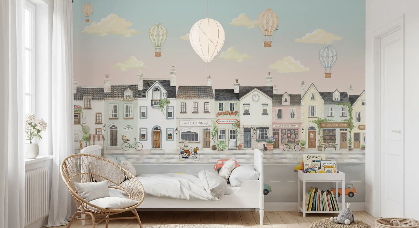 Hot air balloons floating over rooftops in the town wall mural., GD10177