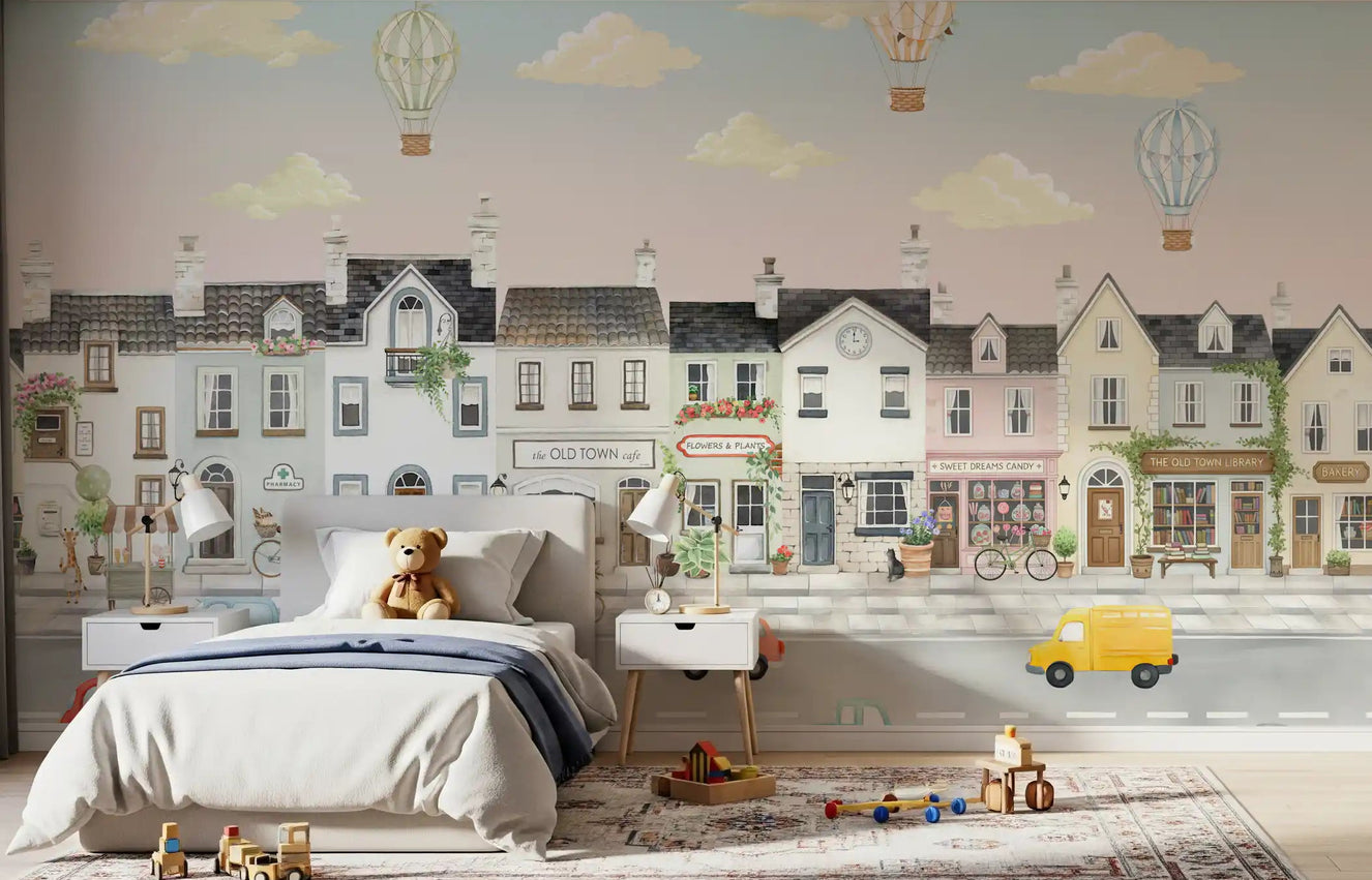 Whimsical town mural covering a kids bedroom feature wall.
