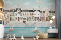 Pale blue sky wall mural with gentle clouds and balloons above old town houses., GD10178
