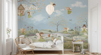 Winged fairies in green and pink dresses above rolling green hills wall mural., GD10179