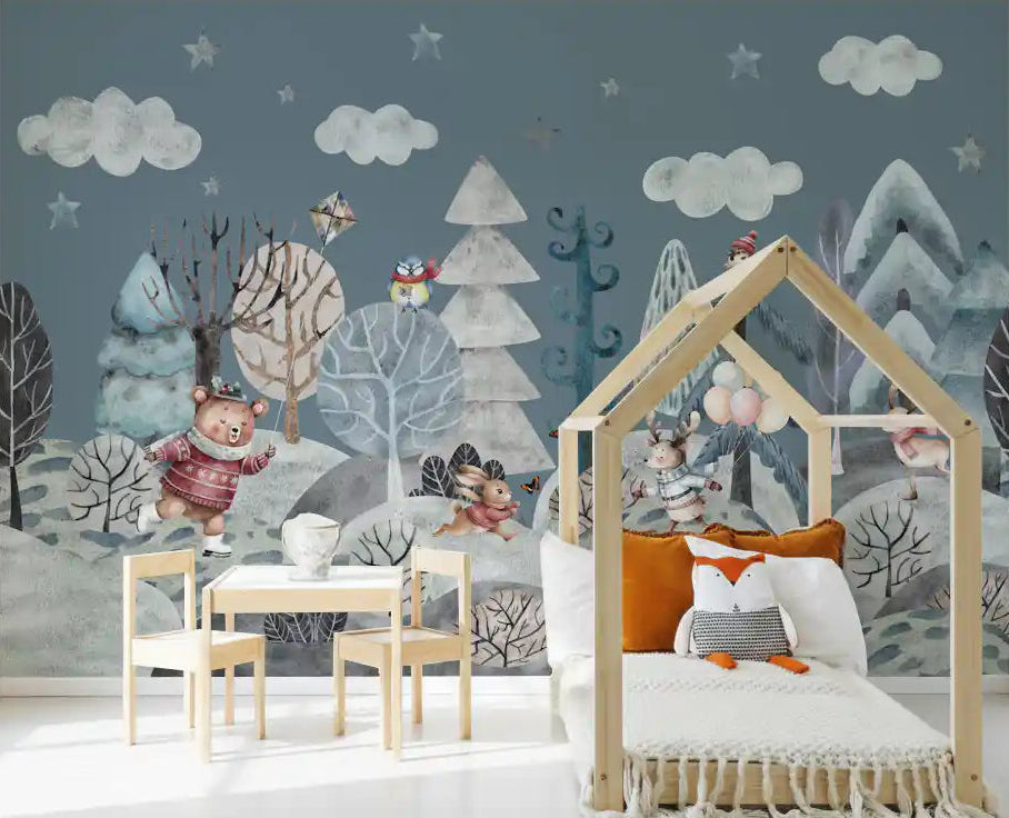 Forest friends winter mural covering a toddler room feature wall.