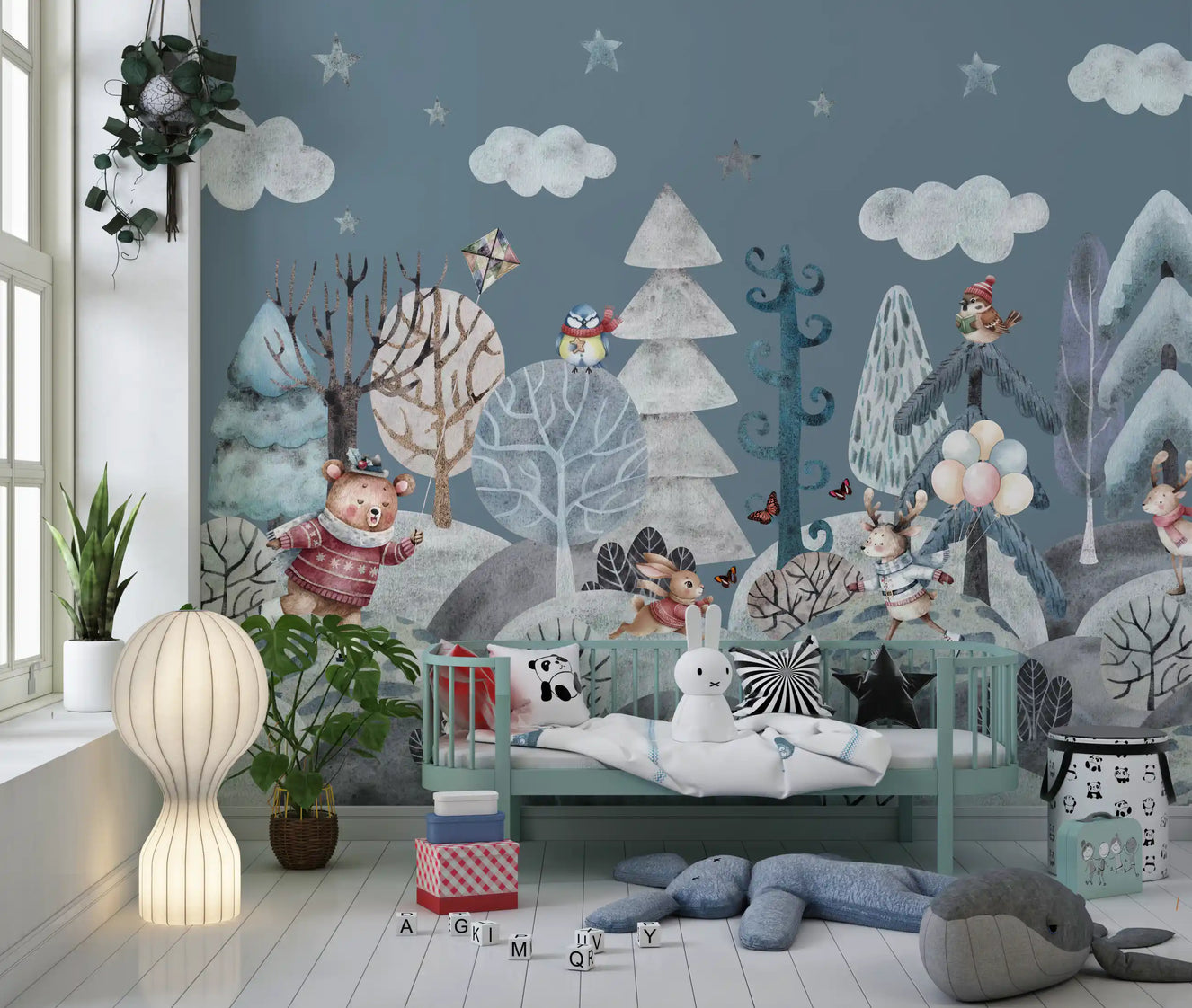 Winter woodland mural with animals on a nursery wall.