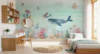 Pink narwhal and tiny fish among bubbles in a calm sea wall mural., GD10191