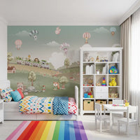 Kids room wall mural with Toy train carrying a giraffe, hedgehog and zebra along a soft green hillside., GD10199