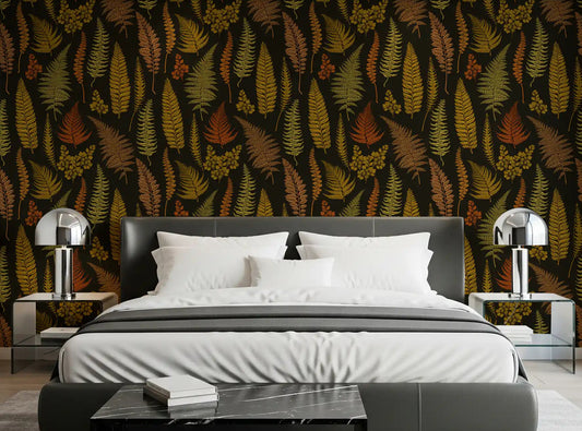 Dark botanical fern wallpaper in warm tone styled on a bedroom wall.