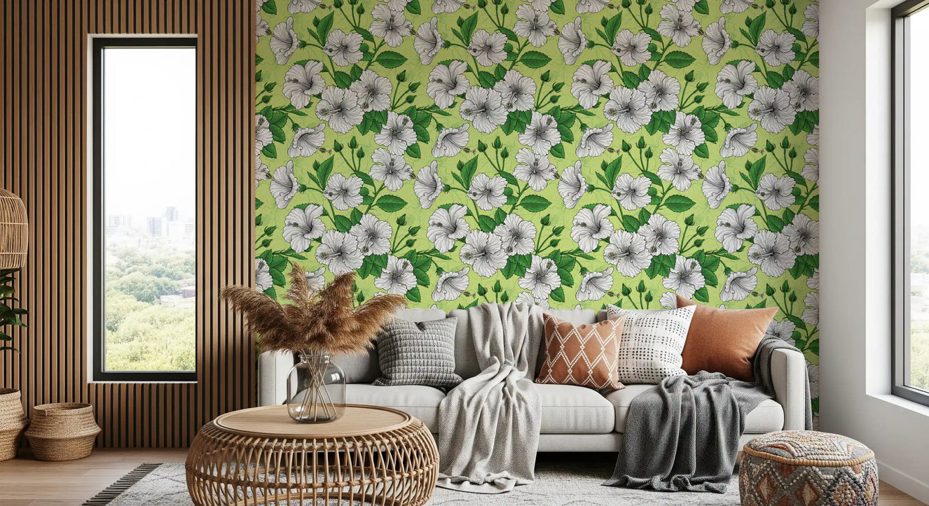 Hibiscus wallpaper across a bright living room feature wall.