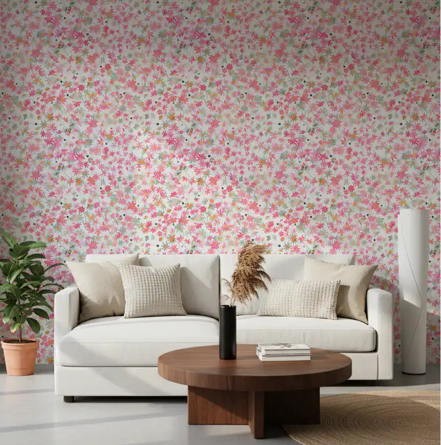 Living room wall styled with a watercolour daisy wallpaper on a soft white base.