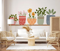 Row of five patterned plant pots on a warm wooden shelf in pastel tones wall mural., GD10224