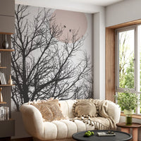 Living room wall mural showing Bare winter branches fanning across a cream backdrop with rose-tinted sun., GD10289
