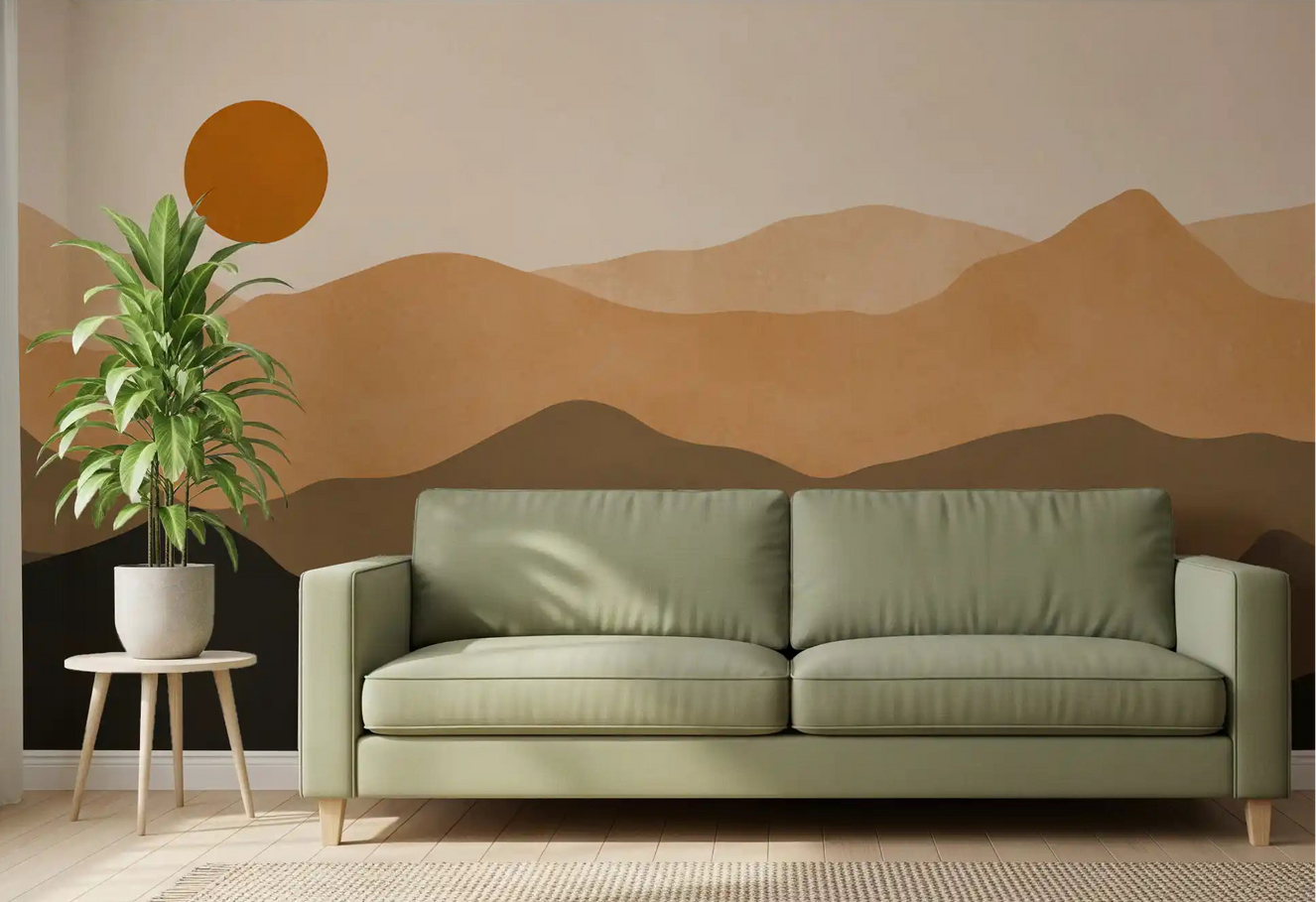 Living room wall styled with earthy mountain sunset mural in warm tan and brown. 