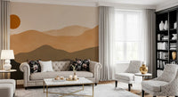 Living room wall mural with Warm-toned peaks layered from pale tan to deep black and a small sun., GD10293