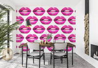 Rows of glossy magenta lips arranged edge to edge across a stark white wall mural. 