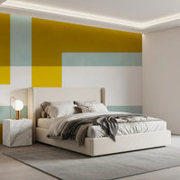 Abstract geometric wall mural in mustard, mint, ivory white and bright lemon shades for bedroom.