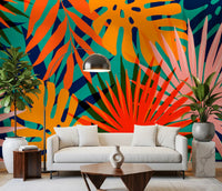 Tropical pattern Wall Mural featuring colourful palm and monstera leaves in living room.
