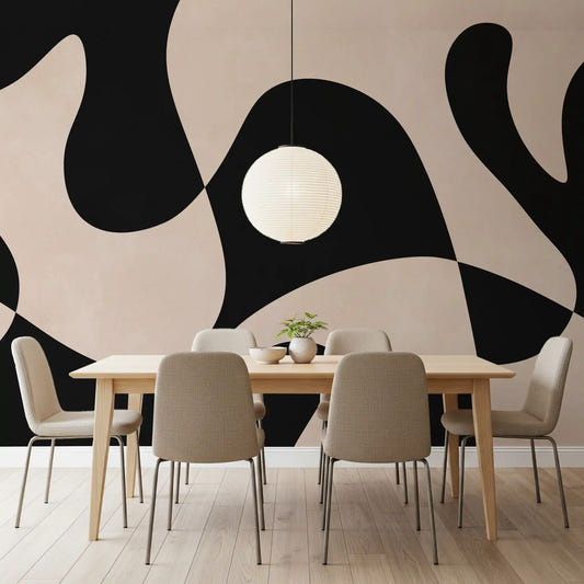 Abstract monochromatic wall mural showing large wavy black and cream shapes in dining room.