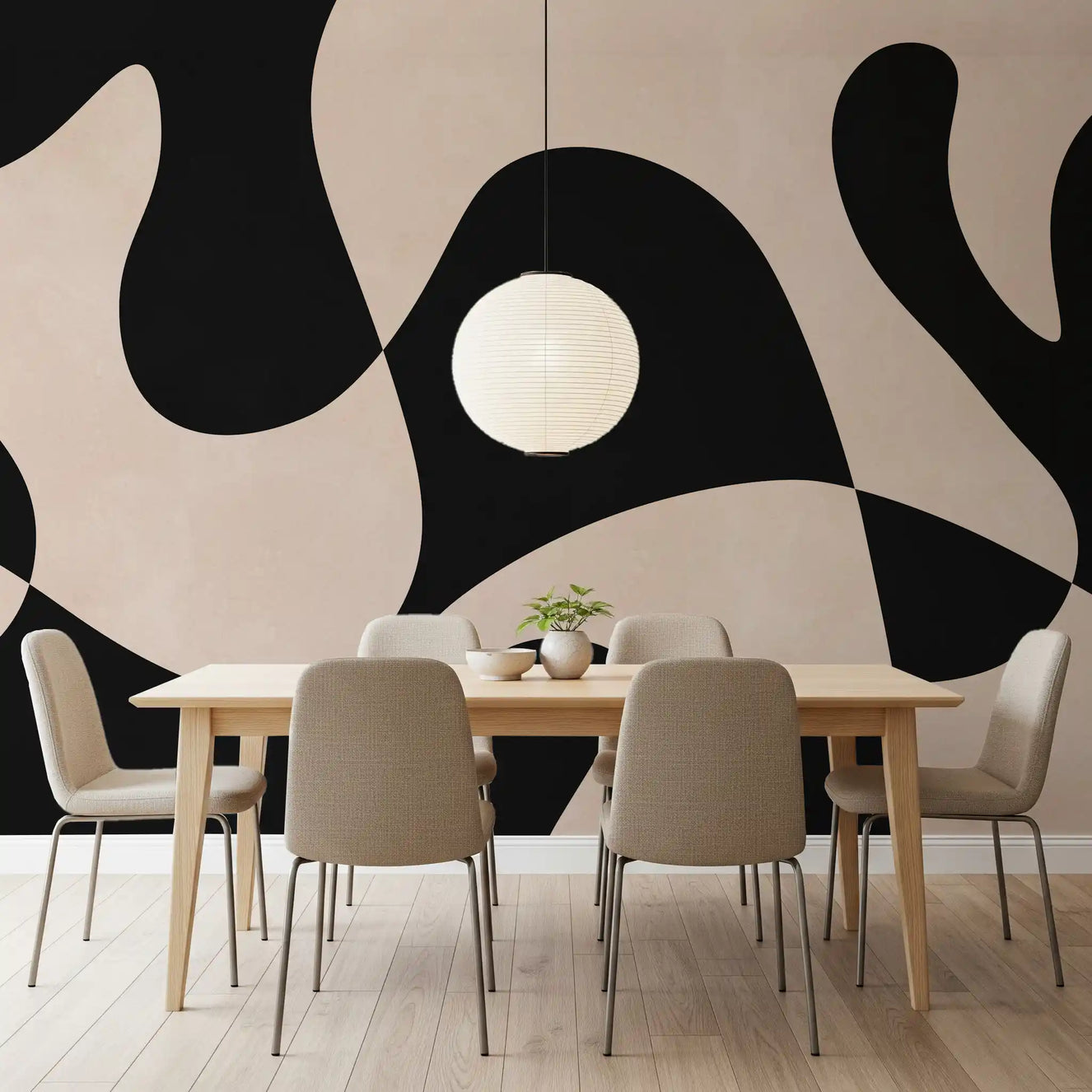 Abstract monochromatic wall mural showing large wavy black and cream shapes in dining room.