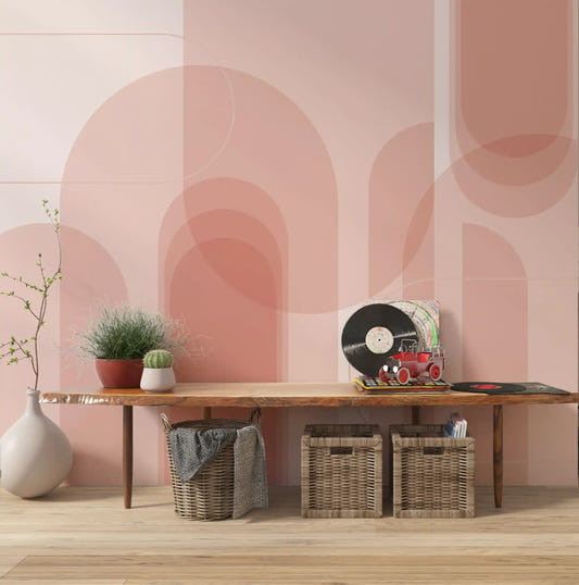 Salmon geometric wall mural with blush arch composition in a hallway.