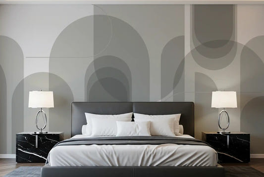 Charcoal and silver geometric wall mural with arches in a master bedroom.