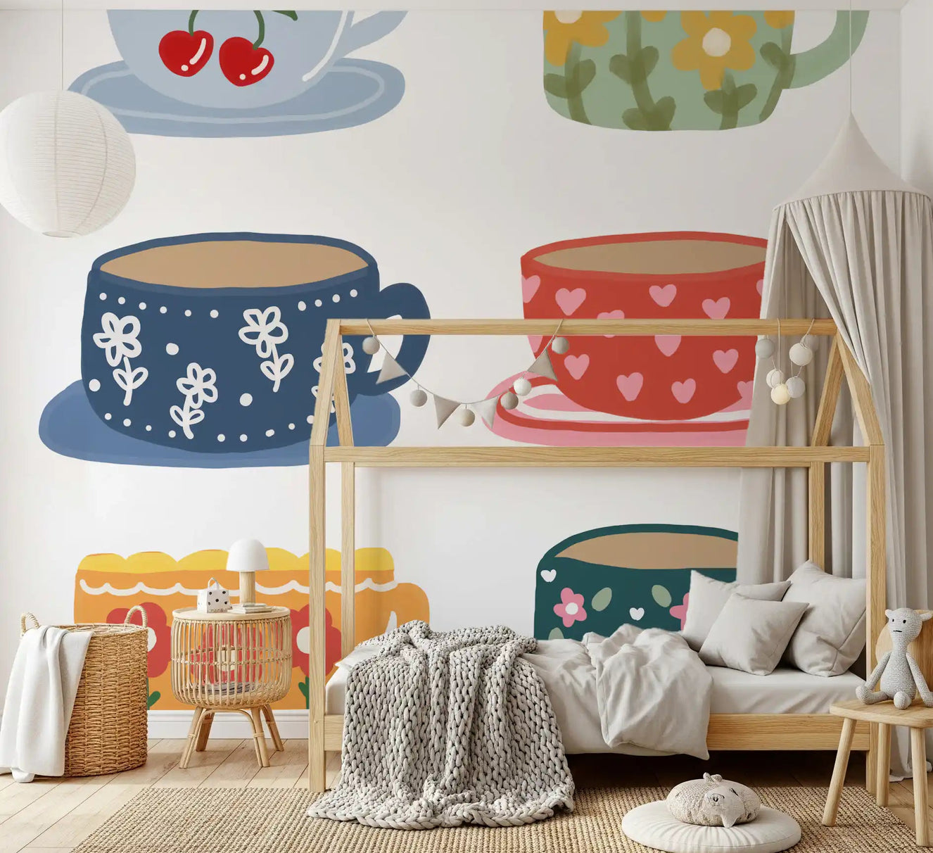 Grid arranged teacup illustrations on white background mural in nursery setting.