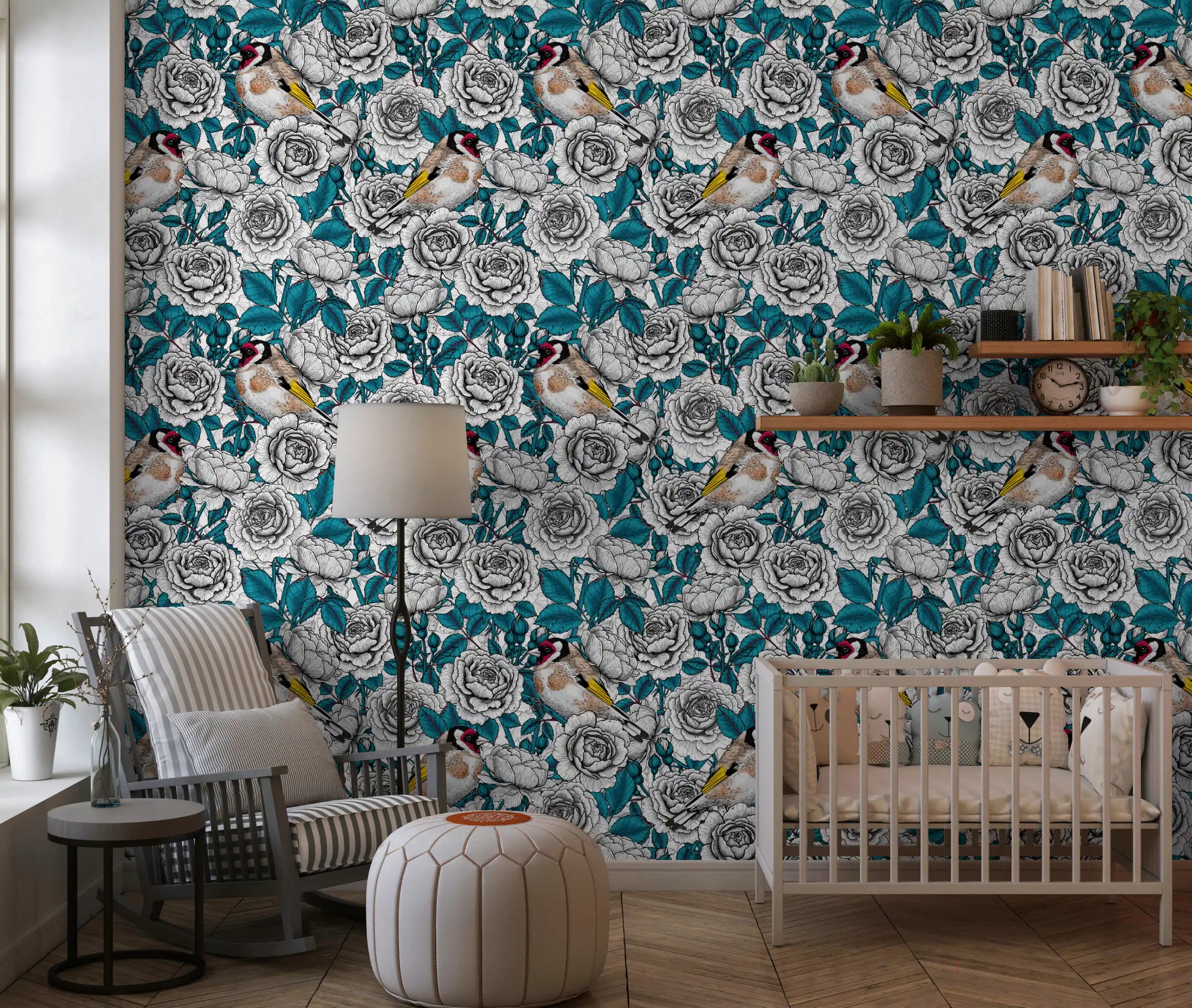 European goldfinch birds perched among white roses on teal leaf wallpaper.