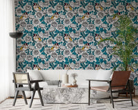 Illustrated goldfinch wallpaper with brown and black feathers on teal leaf backdrop.