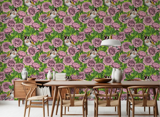 Pink and green floral bird wallpaper applied in a dining room space.