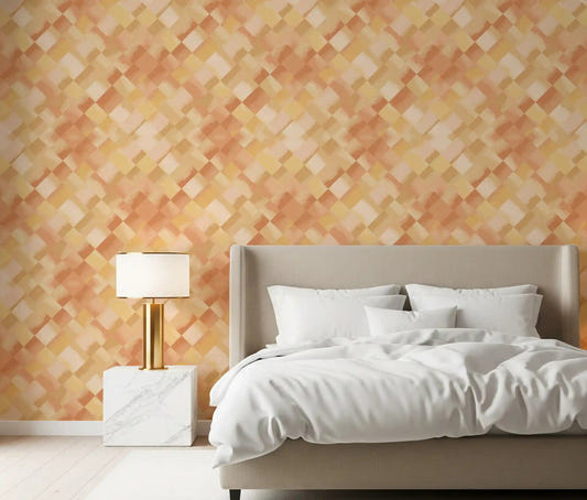 Painted checker wallpaper in warm peach tones displayed in a bedroom setting.