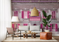 Stone building wall mural with enclosed pink balcony and arched pediments., GD10419