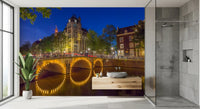 Night canal bridge mural with bicycles along railings and street lamps., GD10420