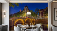Stone bridge wall mural with amber lights forming circles on canal water., GD10420